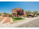 Two-story house featuring desert landscaping, lawn, and neutral-tone exterior paint at 7690 Morning Lake Dr, Las Vegas, NV 89131