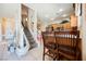 Well-lit kitchen connects to a staircase, features barstool seating, offering convenience and a modern layout at 7690 Morning Lake Dr, Las Vegas, NV 89131