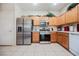Spacious kitchen features stainless steel appliances, ample cabinetry, and a functional layout for easy meal preparation at 7690 Morning Lake Dr, Las Vegas, NV 89131