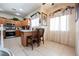 Bright kitchen features modern appliances, stylish cabinetry, and a convenient breakfast bar with seating at 7690 Morning Lake Dr, Las Vegas, NV 89131
