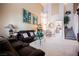 Inviting living room showcasing high ceilings, art, and an open layout, great for gatherings at 7690 Morning Lake Dr, Las Vegas, NV 89131