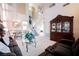 Bright, open living room with high ceilings, staircase, and views to the kitchen, perfect for modern living at 7690 Morning Lake Dr, Las Vegas, NV 89131