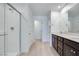 Modern bathroom featuring a glass enclosed shower and double sink vanity at 9756 Rock Cliff St, Las Vegas, NV 89141