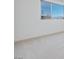Bright bedroom featuring a large window and neutral carpet at 9756 Rock Cliff St, Las Vegas, NV 89141