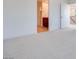 Open bedroom featuring neutral carpet and ensuite bathroom at 9756 Rock Cliff St, Las Vegas, NV 89141