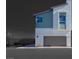 A modern two-story home featuring a neutral color scheme, a garage, and an inviting facade at 9756 Rock Cliff St, Las Vegas, NV 89141