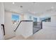 Bright hallway featuring recessed lighting and modern railing at 9756 Rock Cliff St, Las Vegas, NV 89141