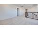 Spacious hallway features modern railing and neutral carpet at 9756 Rock Cliff St, Las Vegas, NV 89141