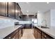 Kitchen with an island, stainless steel appliances, wood cabinets, and hardwood floors at 9756 Rock Cliff St, Las Vegas, NV 89141