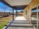 Covered patio in backyard with desert landscaping and privacy fence at 983 Plantain Lily Ave, Las Vegas, NV 89183