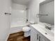 Modern bathroom with a shower-tub combo and white vanity at 983 Plantain Lily Ave, Las Vegas, NV 89183