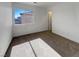 Sun-drenched bedroom featuring carpeted floors and a large window with mountain views at 983 Plantain Lily Ave, Las Vegas, NV 89183
