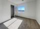 Bright bedroom with a window view and a mirrored closet at 983 Plantain Lily Ave, Las Vegas, NV 89183