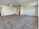A spacious bedroom featuring neutral carpet and an open layout at 983 Plantain Lily Ave, Las Vegas, NV 89183