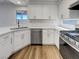 Bright kitchen showcasing stainless steel appliances, white cabinets, and quartz countertops at 983 Plantain Lily Ave, Las Vegas, NV 89183