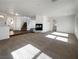 Spacious living room with a fireplace and a staircase leading to the second floor at 983 Plantain Lily Ave, Las Vegas, NV 89183