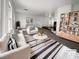 Bright living room with natural light, modern decor, and a stylish striped rug at 983 Plantain Lily Ave, Las Vegas, NV 89183