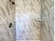 Close-up of a shower featuring a marble tile surround at 983 Plantain Lily Ave, Las Vegas, NV 89183