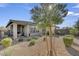 Backyard showcasing a covered patio and low-maintenance landscaping with gravel and various plants, perfect for relaxing at 9903 Spinel Pl, Las Vegas, NV 89143