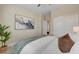 Inviting bedroom showcasing a decorative wall art and closet with a plush bed at 9903 Spinel Pl, Las Vegas, NV 89143