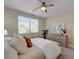 This is a bedroom with neutral paint, carpet, a ceiling fan, and natural light at 9903 Spinel Pl, Las Vegas, NV 89143