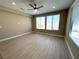 Bright bedroom with light-colored flooring, a ceiling fan, and windows that provide plenty of natural light at 9903 Spinel Pl, Las Vegas, NV 89143