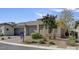 Charming single-story home with three-car garage, desert landscaping and tasteful stone accents at 9903 Spinel Pl, Las Vegas, NV 89143
