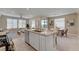 Modern kitchen featuring stainless appliances, a granite island, and an open layout at 9903 Spinel Pl, Las Vegas, NV 89143