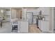 Bright, modern kitchen features a central island, stainless appliances, and sleek cabinetry at 9903 Spinel Pl, Las Vegas, NV 89143