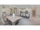 Open kitchen and dining area with modern lighting and views of the island at 9903 Spinel Pl, Las Vegas, NV 89143