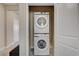Laundry closet with stacked washer and dryer units for convenient home maintenance at 9903 Spinel Pl, Las Vegas, NV 89143