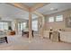 Spacious living area with a dining table, built-in desk, and sliding doors to an outdoor space, providing versatile living at 9903 Spinel Pl, Las Vegas, NV 89143
