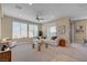 Inviting living area featuring modern furnishings, a ceiling fan, and plenty of natural light at 9903 Spinel Pl, Las Vegas, NV 89143