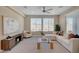 Bright living room showcasing a stylish entertainment center, lots of light, and plush furnishings at 9903 Spinel Pl, Las Vegas, NV 89143