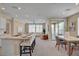 Bright open-concept layout features a dining area, a living room, and a modern kitchen at 9903 Spinel Pl, Las Vegas, NV 89143