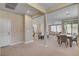 Bright open-concept living space featuring a dining area and a modern kitchen at 9903 Spinel Pl, Las Vegas, NV 89143