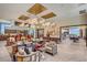 Bright and airy lounge with stylish furniture, contemporary decor, and a view of the outdoor dining area at 9903 Spinel Pl, Las Vegas, NV 89143