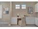 Bright office with a built-in desk, ample storage, and neutral decor at 9903 Spinel Pl, Las Vegas, NV 89143