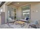 Covered patio with comfortable seating, perfect for outdoor relaxation and entertaining at 9903 Spinel Pl, Las Vegas, NV 89143
