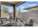 Charming outdoor patio featuring cozy seating arrangements, perfect for relaxing and entertaining at 9903 Spinel Pl, Las Vegas, NV 89143