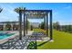Poolside cabana with lounge chairs offers a relaxing space to enjoy the outdoors at 9903 Spinel Pl, Las Vegas, NV 89143