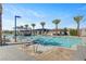Sparkling swimming pool with sun loungers and comfortable seating areas for relaxation at 9903 Spinel Pl, Las Vegas, NV 89143