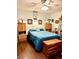 Bedroom with a ceiling fan, wood floors, and ample storage space at , Las Vegas, NV 89117