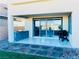 Covered back patio with an outdoor kitchen, barbecue, and a sliding glass door at 10280 Midnight Meteor Ave, Las Vegas, NV 89166