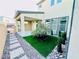 Charming backyard featuring a covered patio, low-maintenance landscaping, and a stylish stone walkway at 10280 Midnight Meteor Ave, Las Vegas, NV 89166