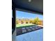 Picturesque backyard featuring artificial turf, shrubs, decorative rocks, and stepping stones at 10280 Midnight Meteor Ave, Las Vegas, NV 89166
