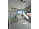 Relaxing bathroom featuring a separate shower and soaking tub with natural light and views at 10280 Midnight Meteor Ave, Las Vegas, NV 89166