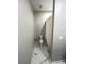 Compact bathroom featuring a toilet and shower with clean, gray walls at 10280 Midnight Meteor Ave, Las Vegas, NV 89166