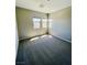 Sunlit bedroom with neutral walls and plush gray carpeting at 10280 Midnight Meteor Ave, Las Vegas, NV 89166