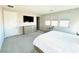 Sunlit bedroom features neutral tones and a comfortable seating area, perfect for unwinding at 10280 Midnight Meteor Ave, Las Vegas, NV 89166